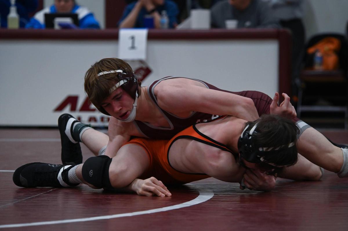 State College’s Hayden Cunningham controls Cathedral Prep’s Sammy Staab in their 127-pound finals match of the PIAA Class 3A Northwest Regional Championships on Saturday, Feb. 25, 2023 in Altoona. Cunningham took care of Staab, 11-3.