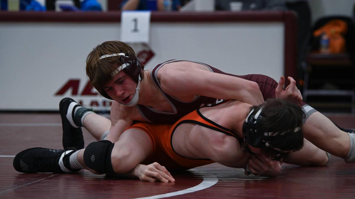 State College’s Hayden Cunningham controls Cathedral Prep’s Sammy Staab in their 127-pound finals match of the PIAA Class 3A Northwest Regional Championships on Saturday, Feb. 25, 2023 in Altoona. Cunningham took care of Staab, 11-3.