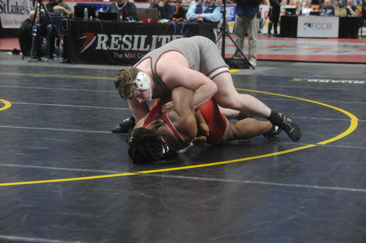 State College’s Nick Pavlechko control’s St. Joseph’s Prep’s Maxwell Roy in their 285-pound first round match of the PIAA Class 3A Championships on Thursday, March 9, 2023 at the Giant Center in Hershey. Pavlechko edged Roy, 8-7.