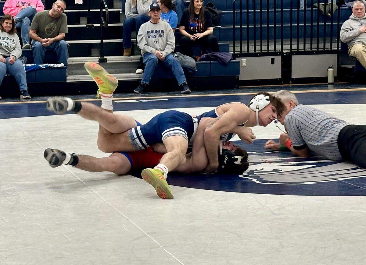 Philipsburg-Osceola’s Caleb Hummel looks to pin West Branch’s Bryce English in their 121-pound match of the Mounties’ 40-21 win in the District 6 Class 2A quarterfinals on Wednesday. Hummel earned a 21-4 technical fall in 3:59.
