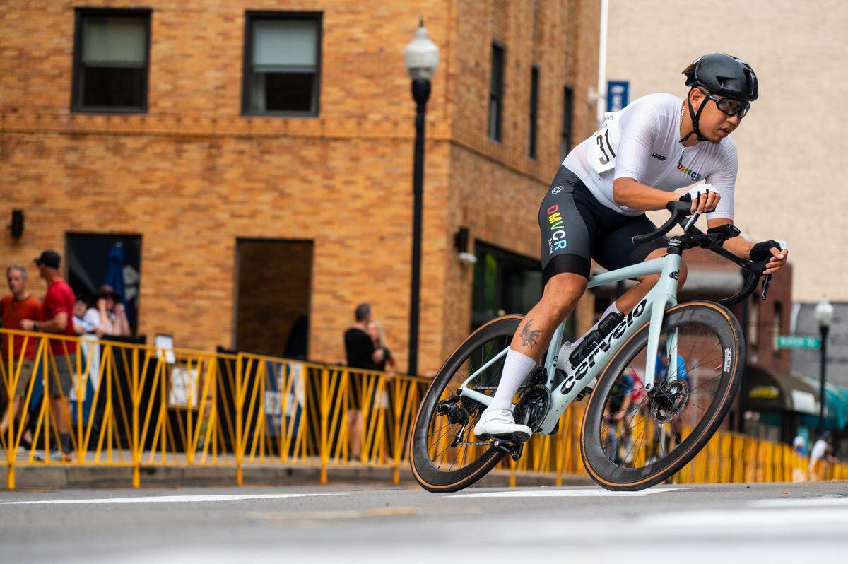A cyclist in the Men’s Cat 1 and Cat 2 race goes around a corner during the State College Criterium on Saturday, July 26, 2025 in State College, Pa.