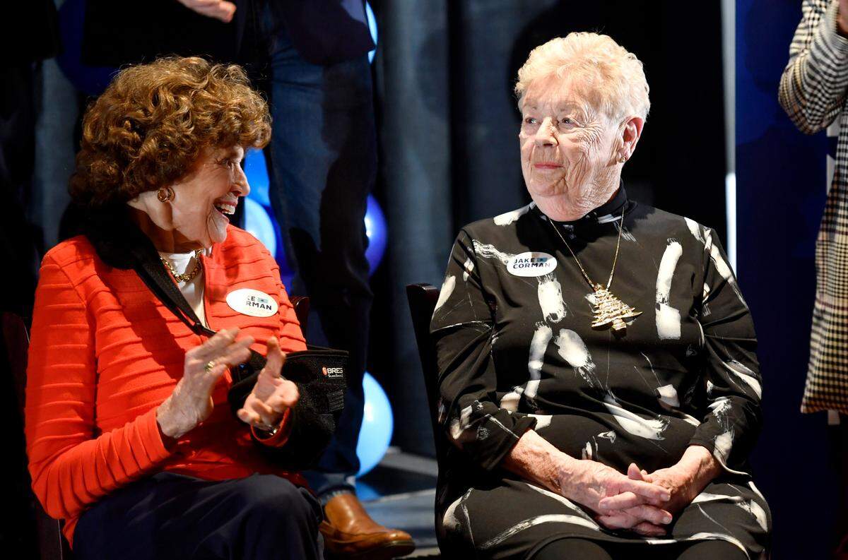 Becky Corman, right, sits next to Sue Paterno and smiles at her son, state Sen. Jake Corman, as he acknowledges her Tuesday during the official kickoff of his campaign for governor.