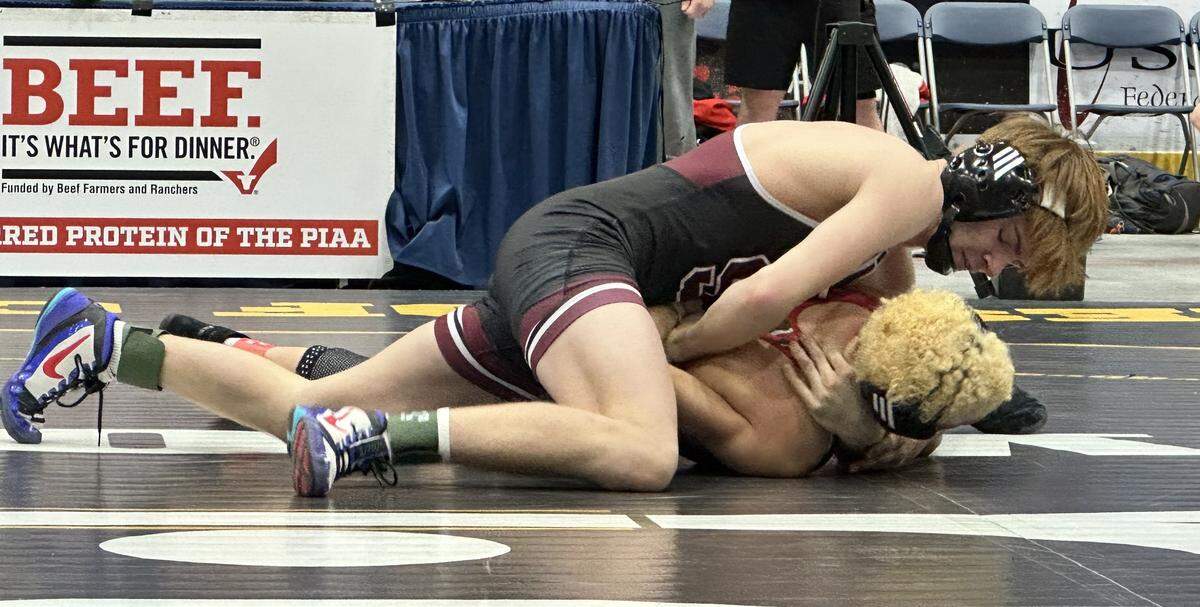 State College’s Kael Davis controls Boyertown’s Boden Waite in their 127-pound bout on Saturday, Feb. 7, 2026 in 1st Summit Arena in Johnstown at the consolation quarterfinals of the PIAA Class 3A Team Wrestling Championships. Davis tallied a 14-2 major decision, but the Little Lions lost overall 29-27.