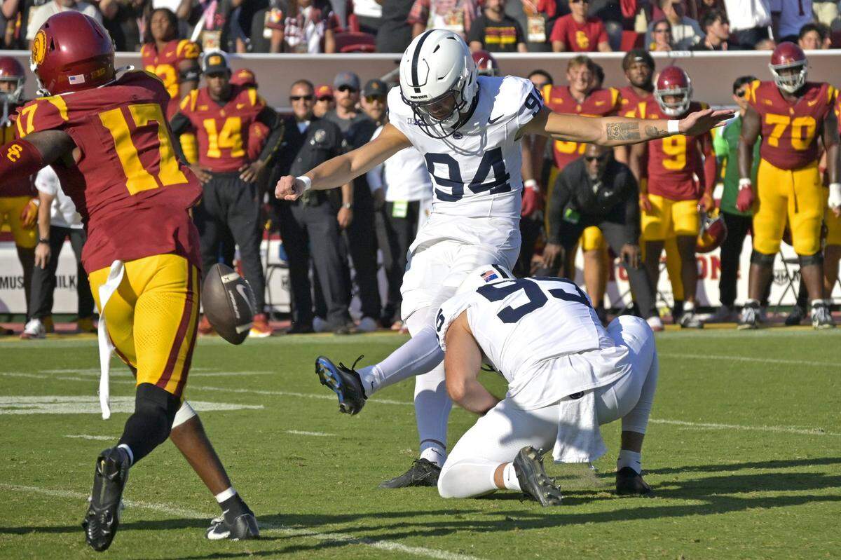 Oct 12, 2024; Los Angeles, California, USA; USC Penn State Nittany Lions place kicker Ryan Barker (94) hits a field goal in overtime to defeat the USC Trojans at United Airlines Field at the Los Angeles Memorial Coliseum. Mandatory Credit: Jayne Kamin-Oncea-Imagn Images