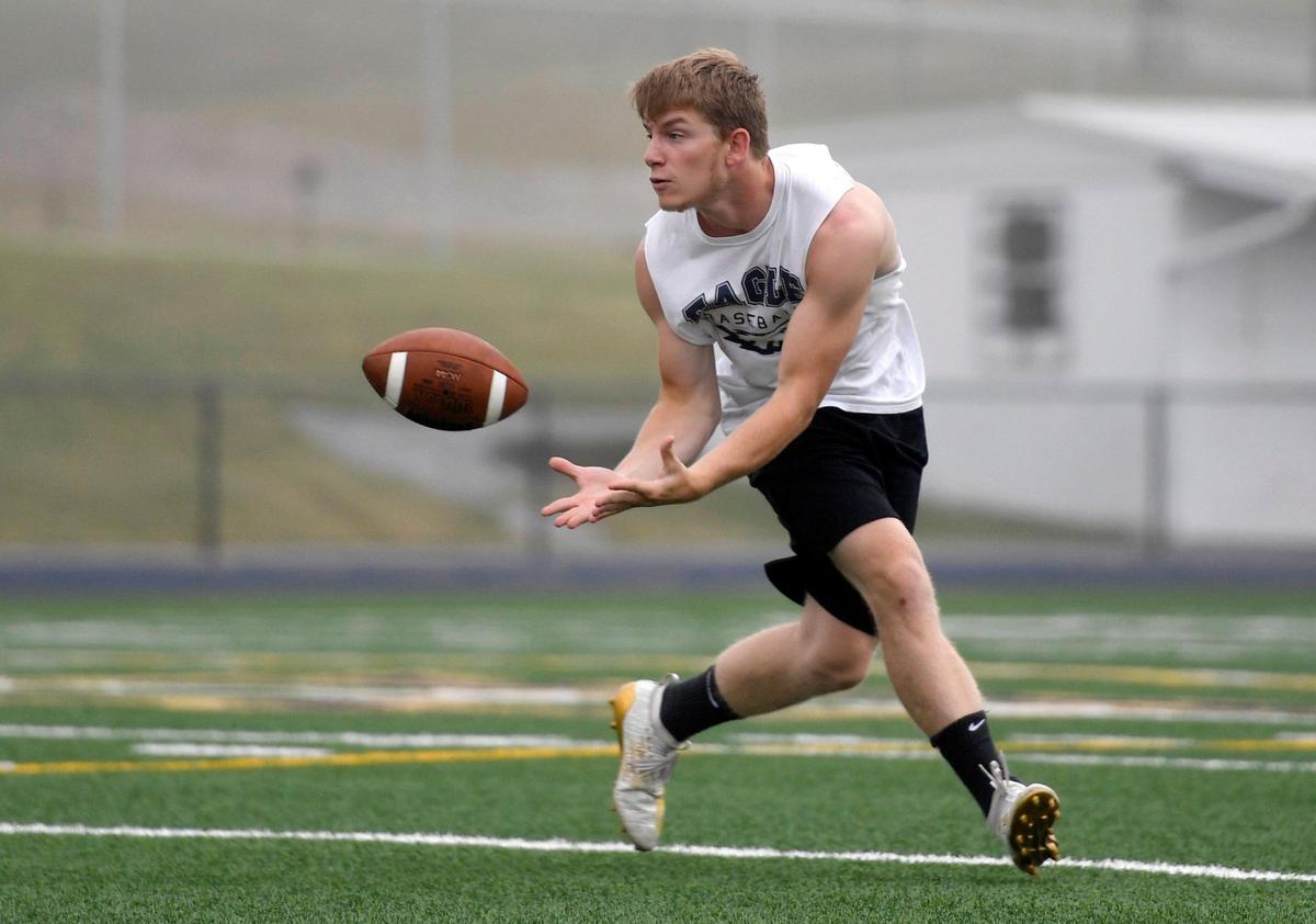 Bald Eagle Area football players run some plays during a socially distanced practice on Friday, July 10, 2020.