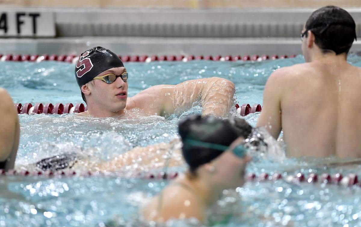 State College’s Matt Brownstead warms up with teammates during the meet against Carlisle on Thursday, Jan. 9, 2020.