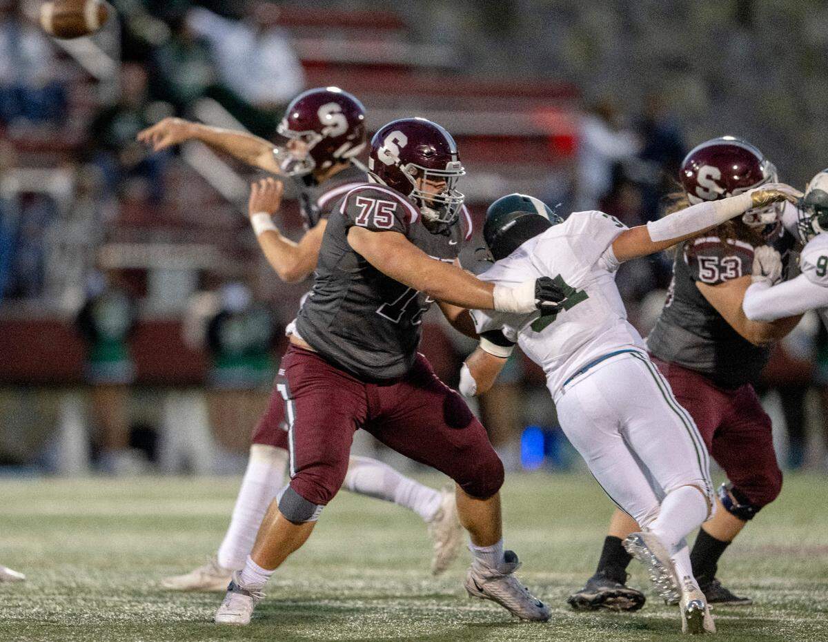 State College’s Michael Dincher blocks a Central Dauphin linebacker during the game on Friday, Sept. 23, 2022 at Memorial Field.