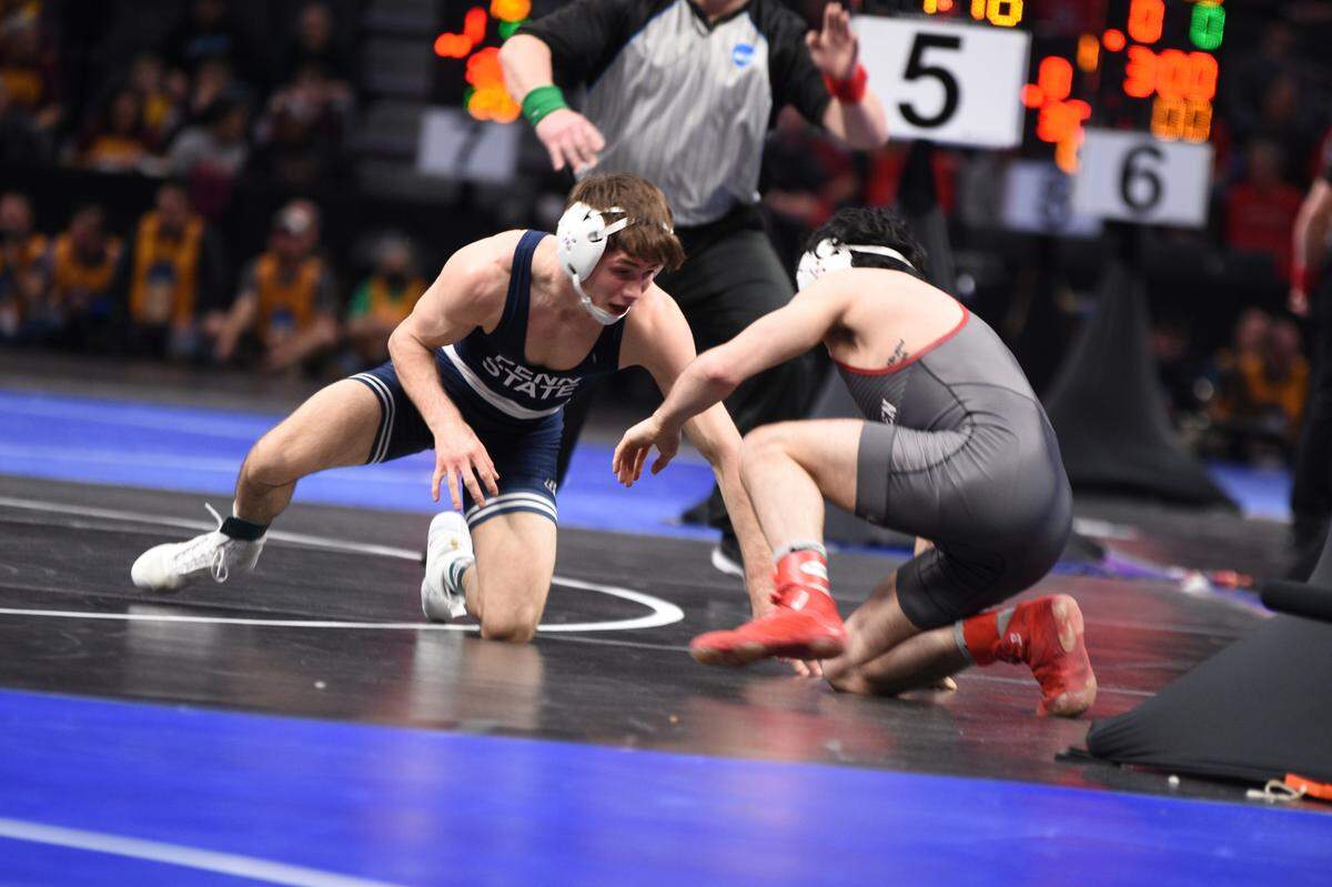 Penn State’s Drew Hildebrandt looks for an opening on Lock Haven’s Anthony Noto in their 125-pound first round bout of the NCAA Championships on Thursday, March 17, 2022 at Little Caesar’s Arena in Detroit. Noto beat Hildebrandt, 4-2, in sudden victory.