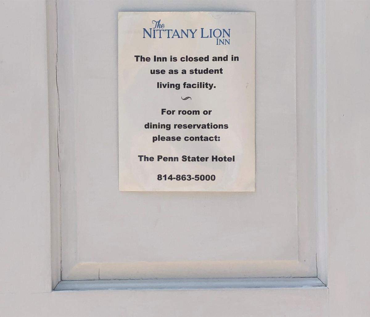 A sign on an entrance to the Nittany Lion Inn refers potential guests Wednesday to the Penn Stater Hotel & Conference Center, about an 8-minute drive away. The inn has been closed to the general public since March 2020 due to the pandemic.