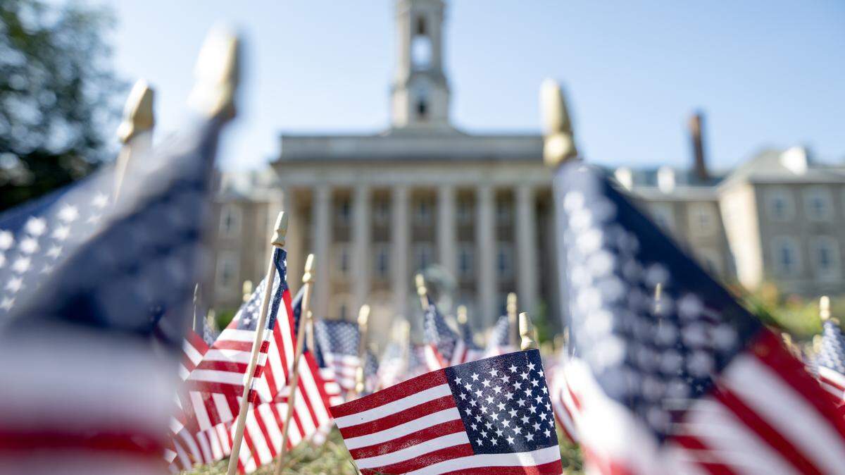 A patch of American flags on the Old Main lawn on Tuesday, Sept. 9, 2025.  The 2,997 flags honor each victim killed on Sept. 11, 2001.  