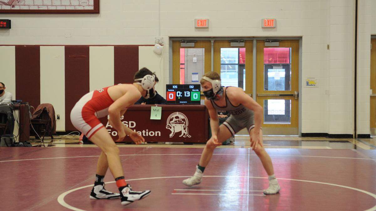 Bellefonte’s Jude Swisher, left, and State College’s Pierson Manville look for an opening to score in their 132-pound Big 7 title match on Saturday in Altoona. Swisher topped Manville 10-6.