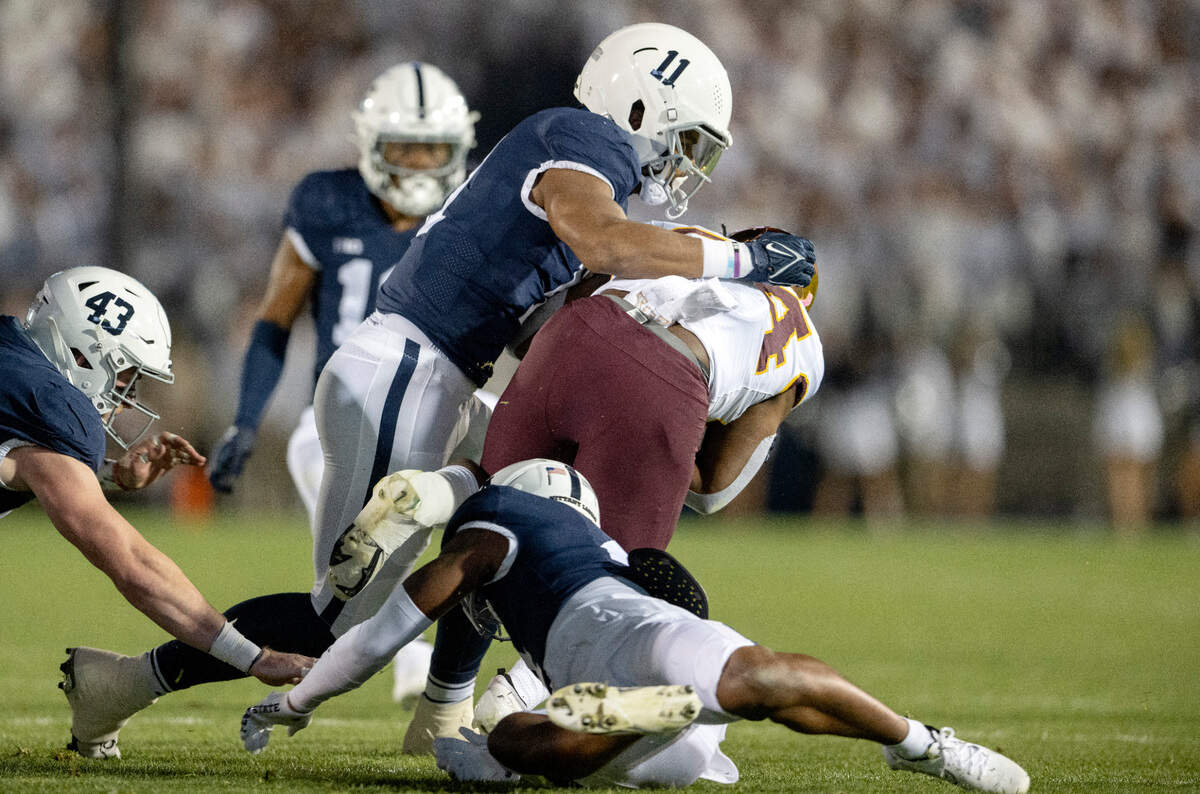 Penn State linebacker Abdul Carter stops Minnesota’s Mohamed Ibrahim during the game on Saturday, Oct. 22, 2022.