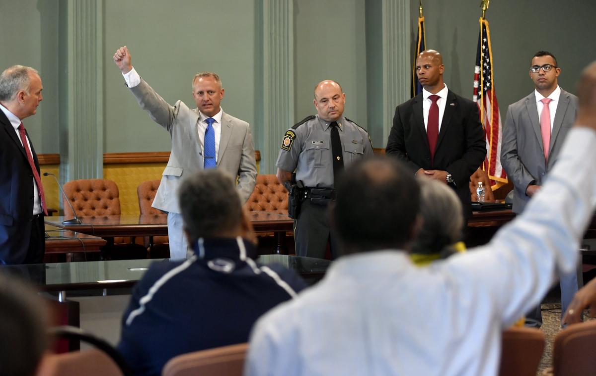 State police at Rockview Corporal Thomas Stock answers a question from a community member Wednesday about Osaze Osagie hiding a weapon behind the door frame when police arrived at his apartment on March 20. The report of the investigation into the shooting was released on May 8, 2019, and said the use of force was justified.