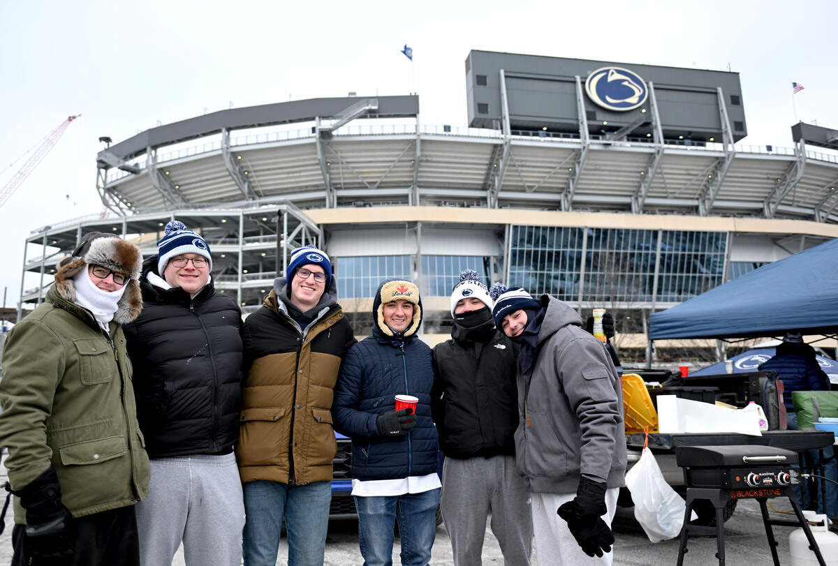 A group of Penn State fans have a bachelor party tailgate outside of Beaver Stadium before the men’s hockey game on Saturday, Jan. 31, 2026.