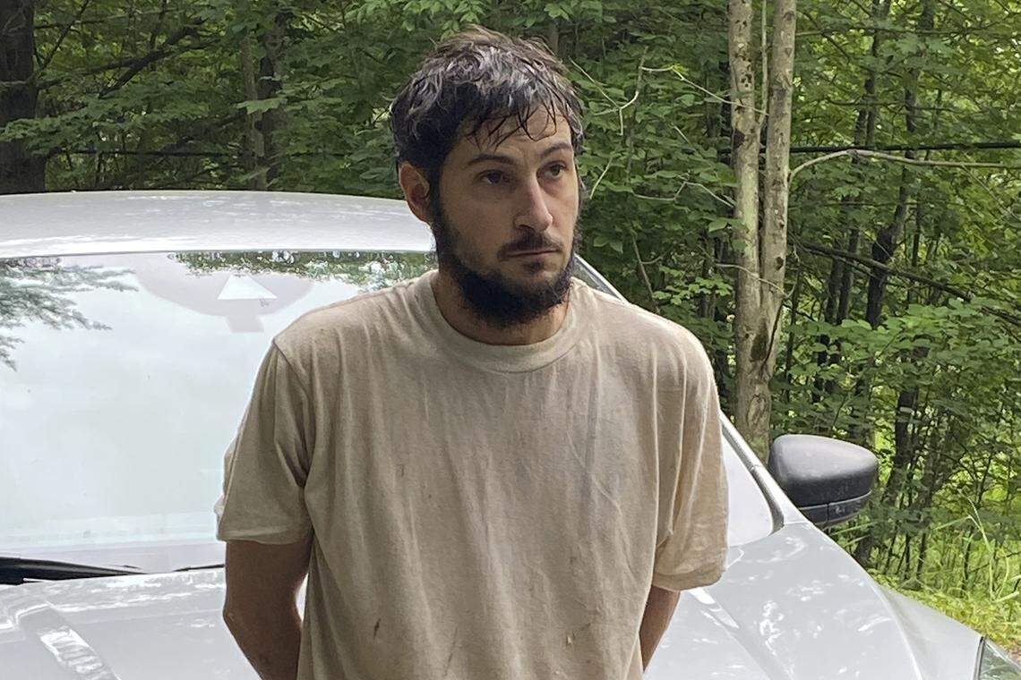 This image provided by Pennsylvania State Police shows homicide suspect Michael Burham after he was recaptured on July 15, 2023. Burham, who was the subject of a manhunt in two states after his escape from a northern Pennsylvania jail, is facing more charges in both the escape and in the original case alleging he kidnapped a couple and forced them to accompany him on his cross-country flight to avoid authorities.