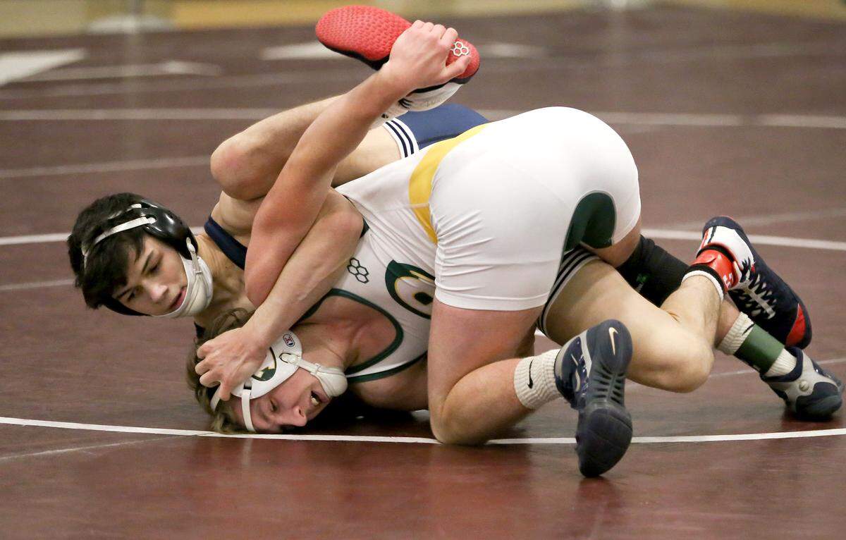 Philipsburg-OsceolaÕs Austin Foster controls Forest HillsÕ Noah Teeter in the 138 lb third place bout at the District 6 AA wrestling on Saturday, Feb. 20, 2021.