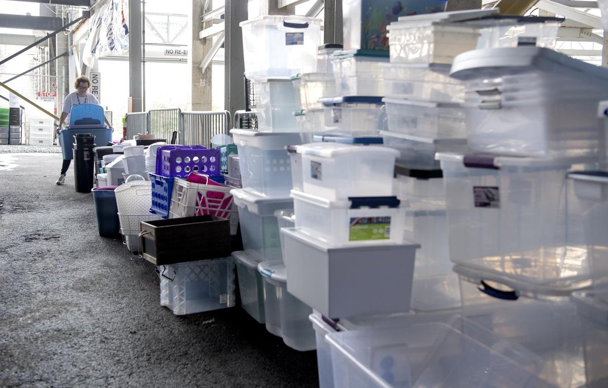 Volunteers help on Friday to finish the preparation for the Trash to Treasure sale at Beaver Stadium.