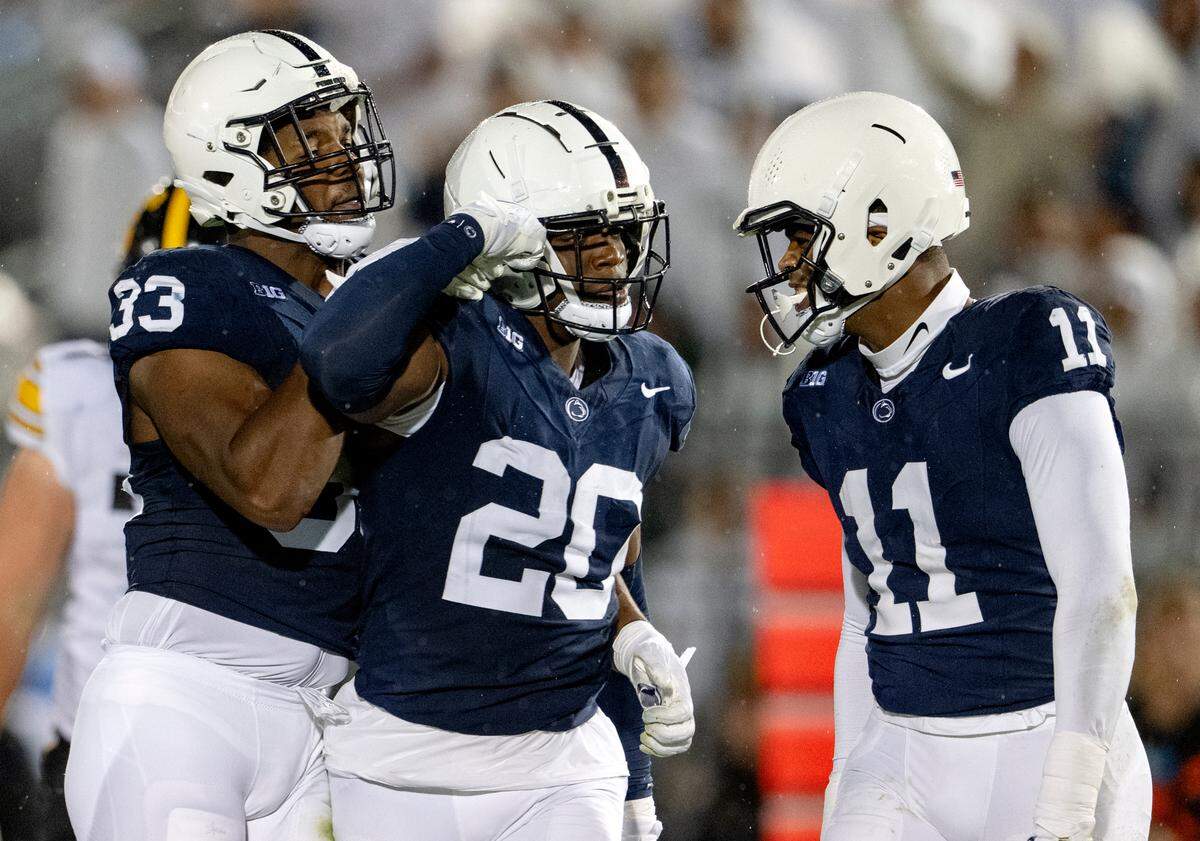 Penn State’s Dani Dennis-Sutton, Adisa Isaac and Abdul Carter celebrate a play during the game against Iowa on Saturday, Sept. 23, 2023.