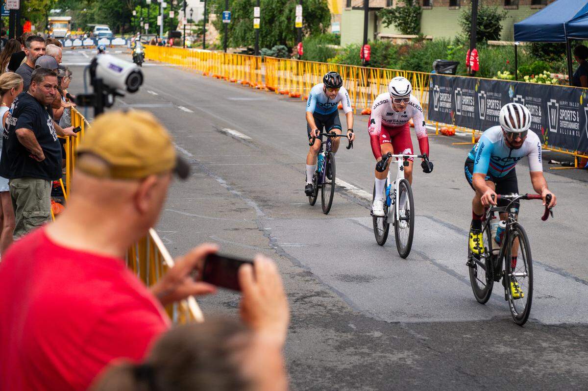 Participants in the Men’s Cat 1 and Cat 2 race cycle down Beaver Avenue during the State College Criterium on Saturday, July 26, 2025 in State College, Pa.