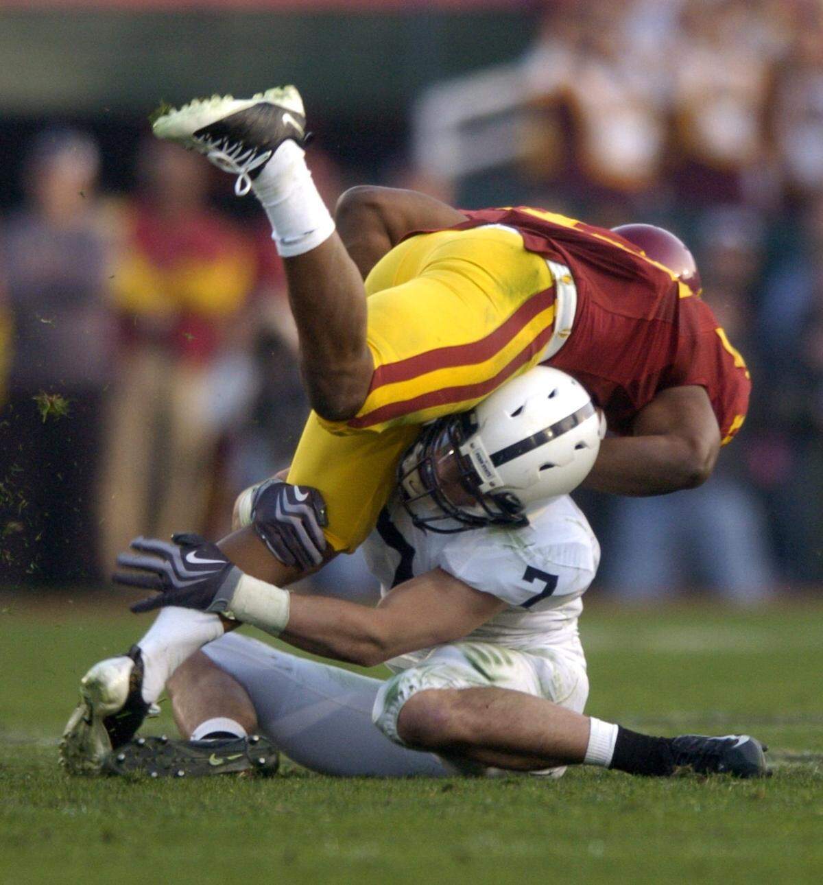 Anthony Scirrotto tackles Stafon Johnson in the second half of a game.