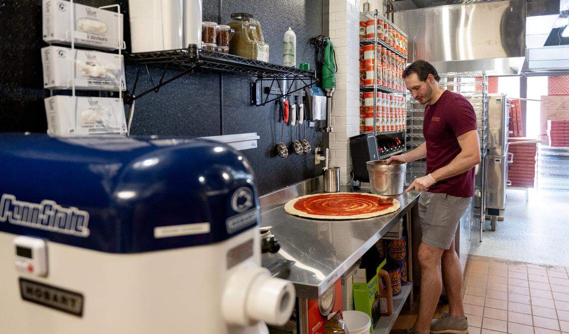 Collin Farrell makes a 28-inch pizza at Benny Leone’s on Wednesday, June 4, 2025.