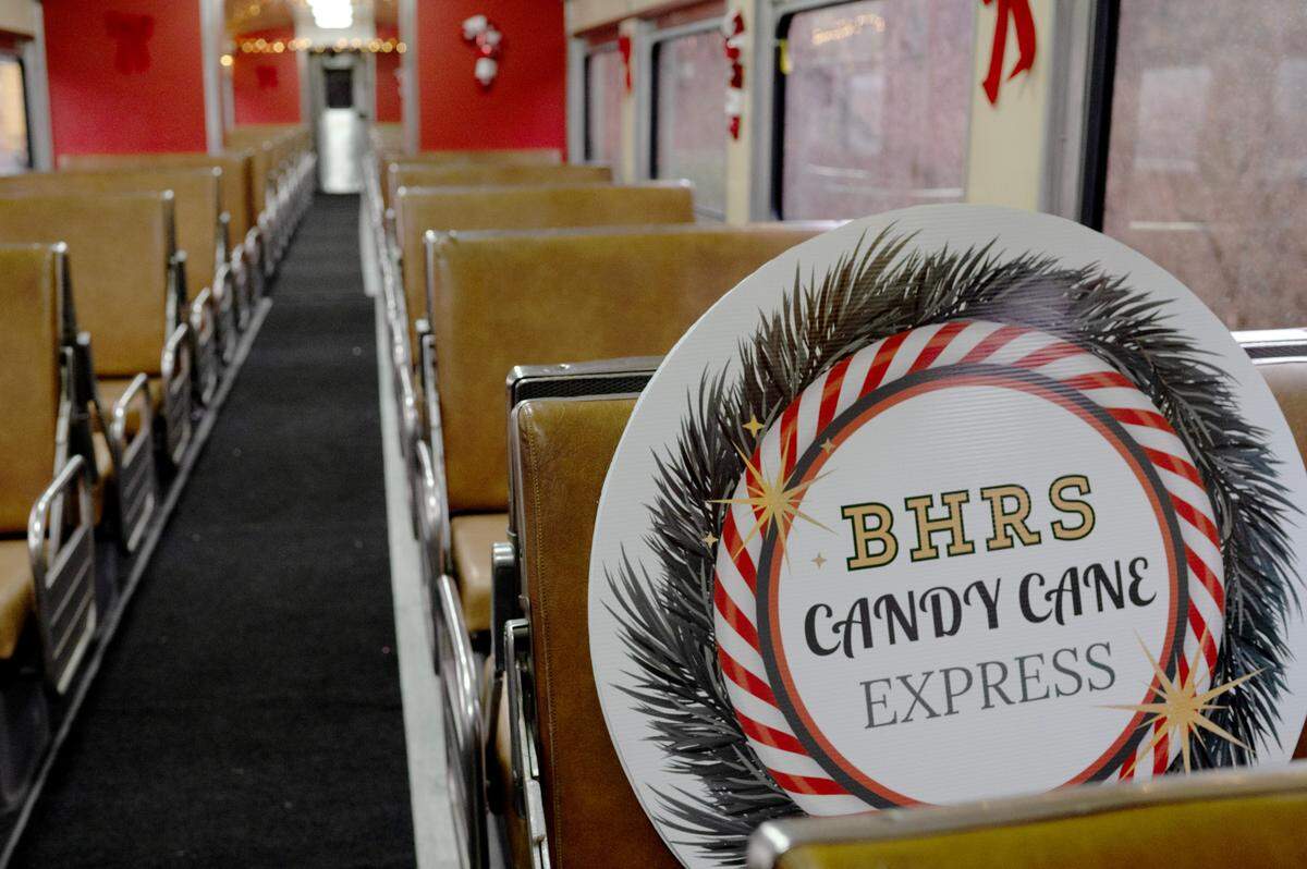A sign for the Candy Cane Express sits inside one of the train cars for the Bellefonte Historical Railroad Society on Wednesday, Dec. 11, 2024.