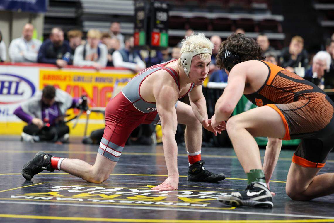State College’s Pierson Manville faces Central York’s Elias Long in the 145-pound PIAA Class 3A semifinal match on Friday, March 8, 2024 at the Giant Center in Hershey. 