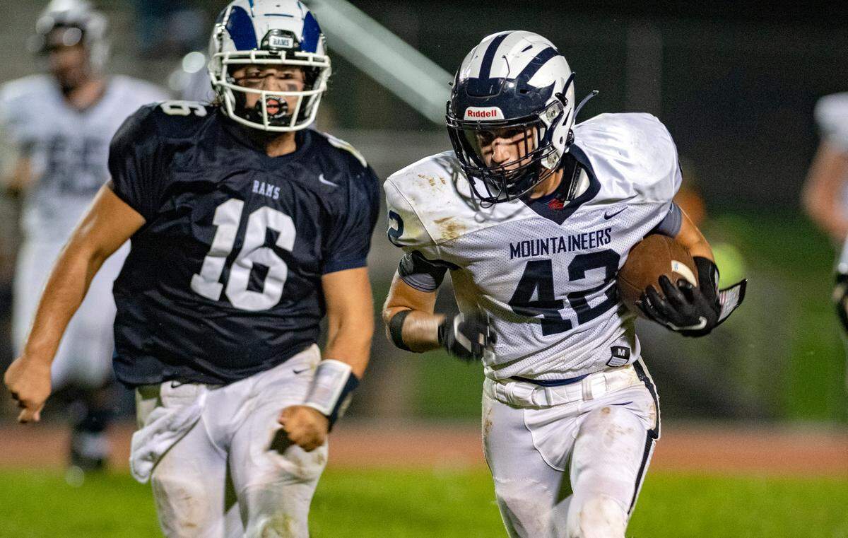 Philipsburg-Osceola’s Andrew Faust cuts down the field with the ball from Penns Valley’s Rylee Brungart during the game on Friday, Sept. 17, 2021.
