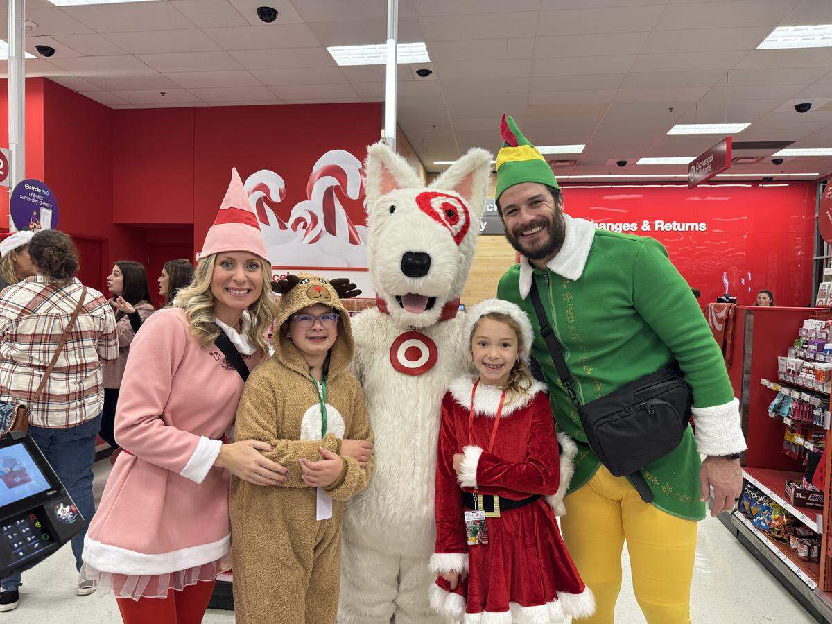 Dressed as Elf, Nathan Stupar is pictured at a Target shopping spree for kids hosted by his nonprofit, State of Hope Foundation.