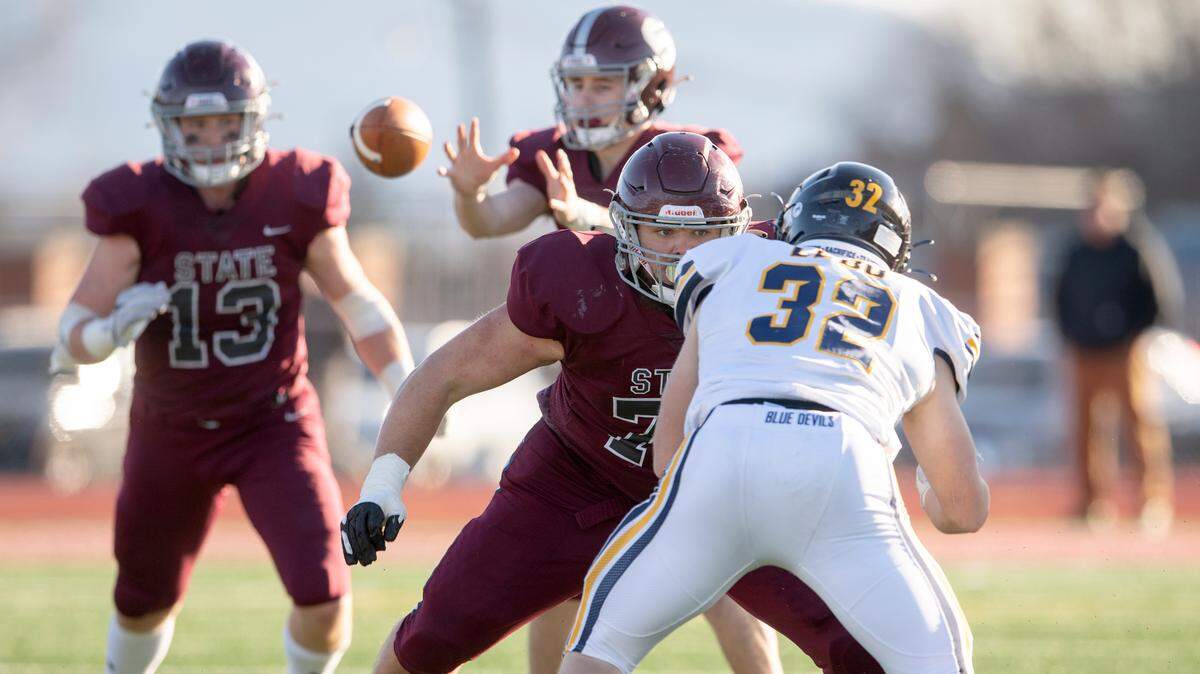 State College offensive lineman Michael Dincher blocks Mt. LebanonÕs Grayson Dee during the PIAA class 6A semifinal game on Saturday, Dec. 4, 2021 at Mansion Park. Mt. Lebanon won, 49-28.
