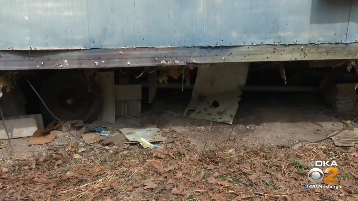 A decomposing body was found under this Pennsylvania mobile home while a man was trying to fix a plumbing issue, police say.