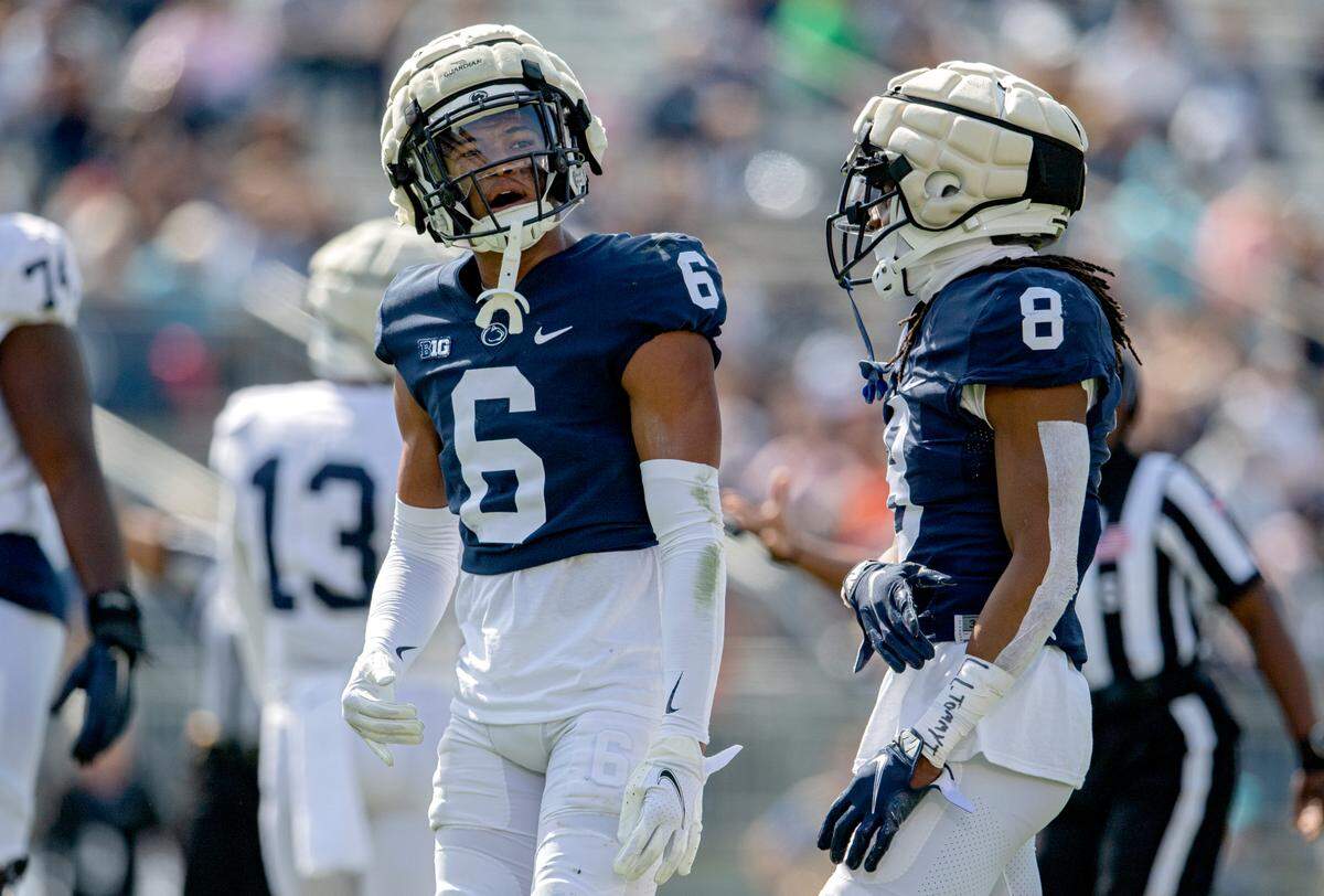 Penn State cornerback Zakee Wheatley and Marquis Wilson celebrate a play during the Blue-White game on Saturday, April 23, 2022.