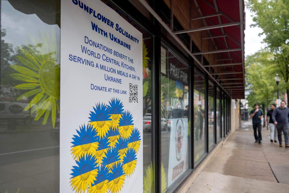 The Downtown State College Improvement District has partnered with local artists and businesses to paint sunflowers in the windows to show support for Ukraine.