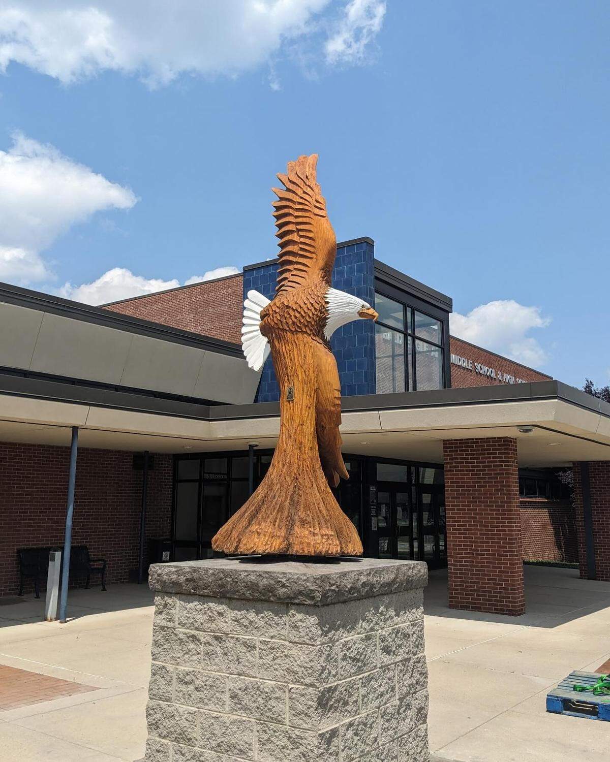 This wood carving, donated by an anonymous graduate, now sits outside Bald Eagle’s middle and high school.