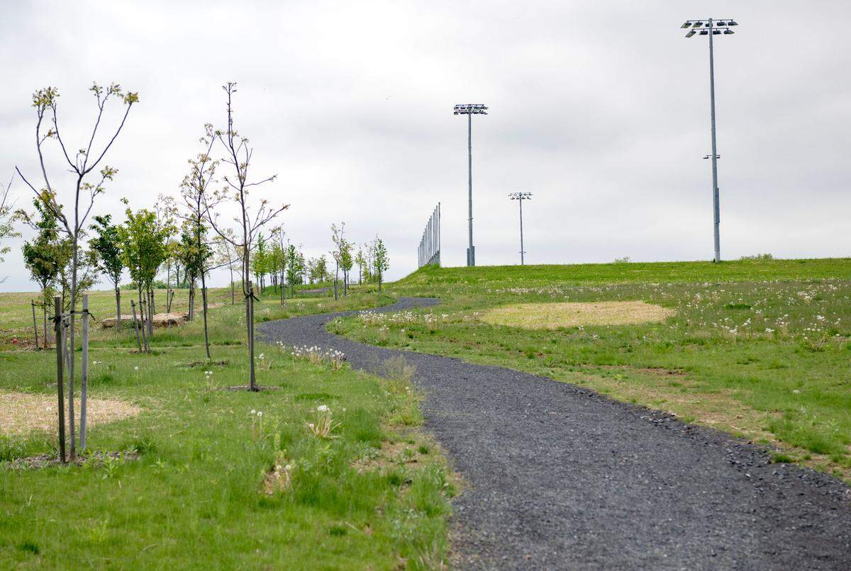 A walking trail goes around the entire Whitehall Road Regional Park on Tuesday.