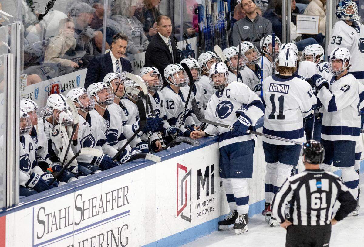 Penn State men’s hockey coach Guy Gadowsky talks to players and the referee as a call is reviewed during the game against Michigan on Friday, Nov. 4, 2022 at Pegula Ice Arena.