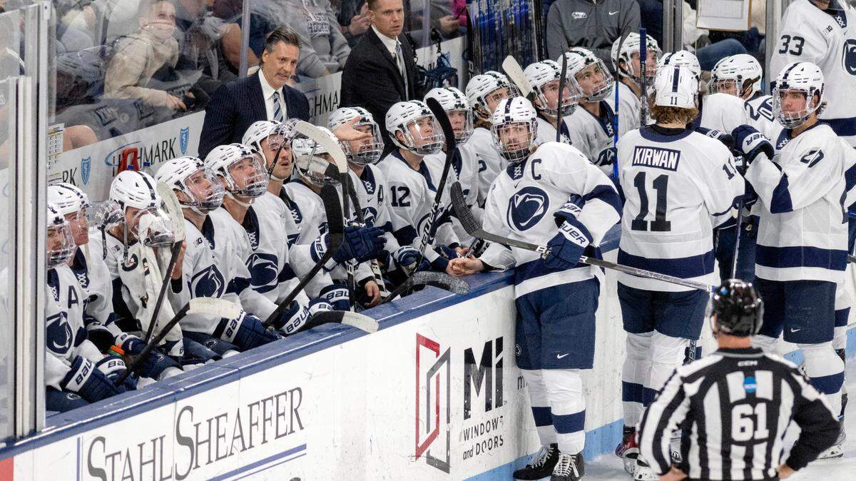 Penn State men’s hockey coach Guy Gadowsky talks to players and the referee as a call is reviewed during the game against Michigan on Friday, Nov. 4, 2022 at Pegula Ice Arena.