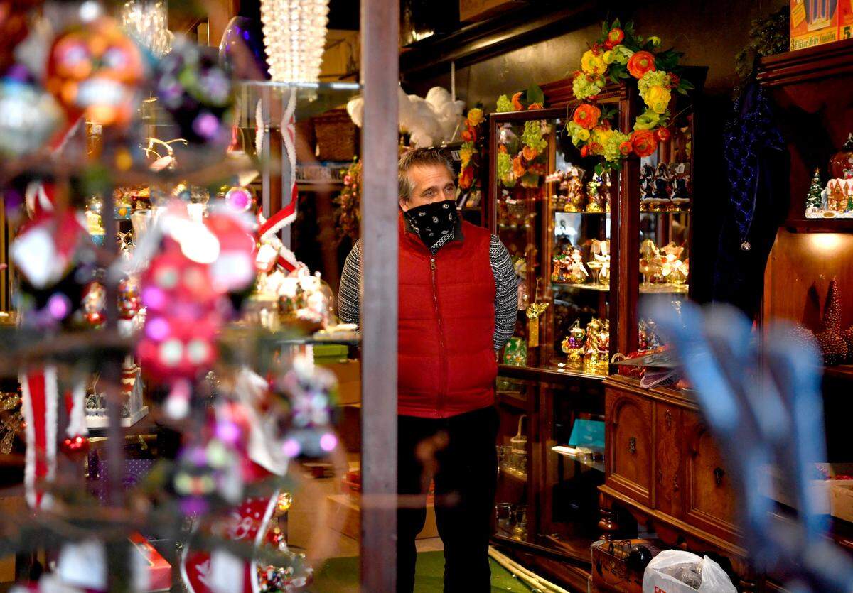 Mitch Ballas stands among the ornaments and gifts at George’s Floral Boutique on Thursday, Jan. 7, 2021.