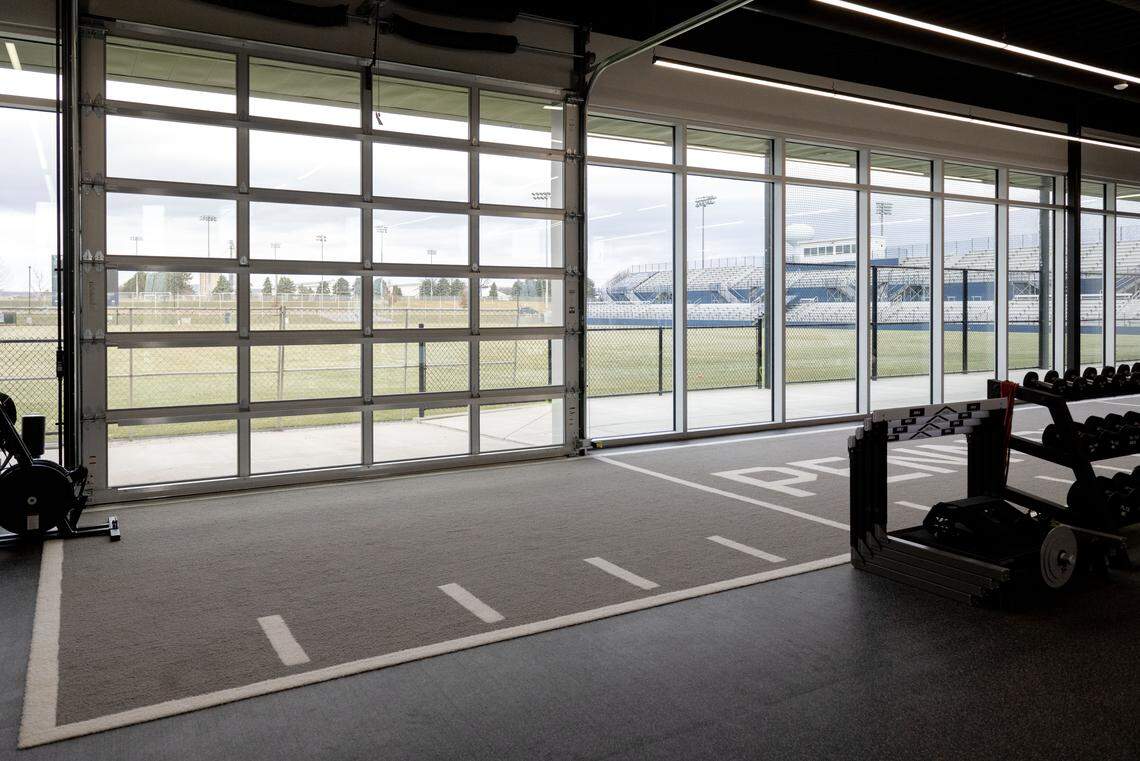 A garage door in the weight room opens to the playing field at new Jeffrey Field Soccer complex.  