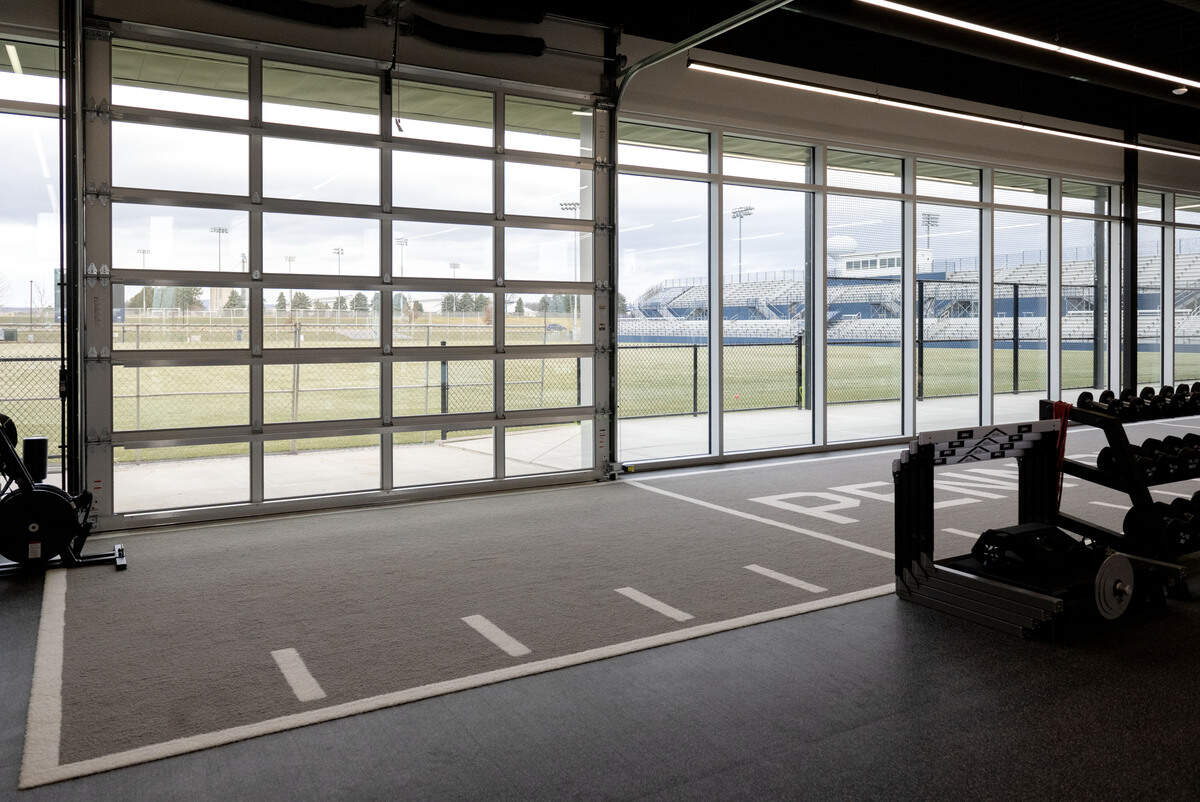A garage door in the weight room opens to the playing field at new Jeffrey Field Soccer complex.