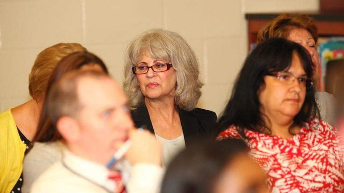 Elaine Cutler, former Bellefonte Middle School principal, listens as the Bellefonte Area School Board discusses their reasons for firing her on Tuesday night during a regular meeting at the Bellefonte High School Library.
