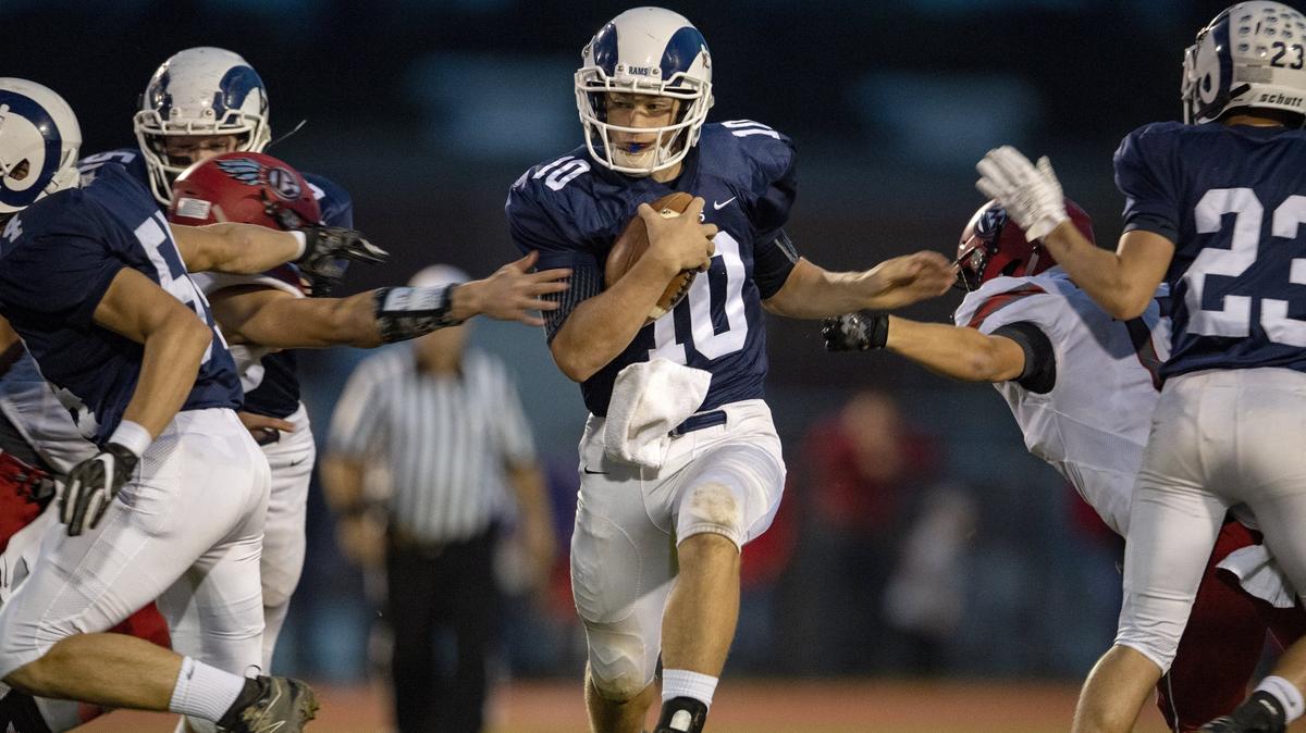 Penns Valley quarterback Aaron Tobias cuts through the line of Bellefonte defenders during the Friday, Oct. 5, 2018 game.