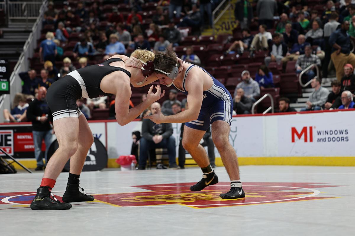 Penns Valley’s Kollin Brungart hand fights with Cranberry’s Brayden McFetridge in their 215-pound consolation second round match of the PIAA Class 2A Championships on Friday, March 10, 2023 at the Giant Center in Hershey. McFetridge pinned Brungart in 2:06.