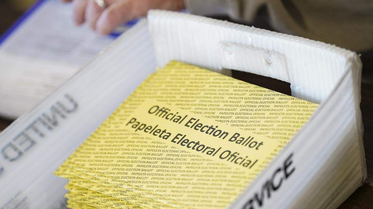 Workers sort mail ballots on Nov. 5, 2024, at Northampton County Courthouse in Easton, Pennsylvania.