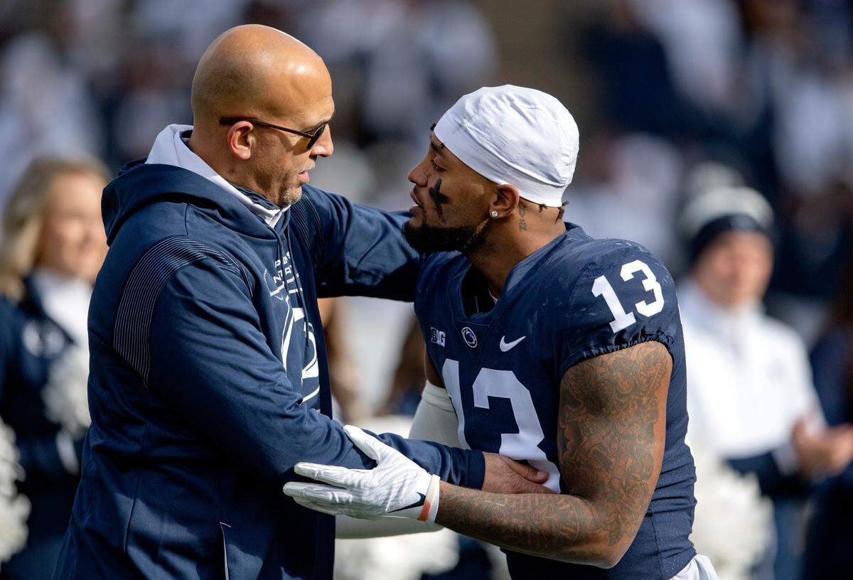 Penn State linebacker Ellis Brooks is congratulated by coach James Franklin during the senior day celebration before the game against Rutgers on Saturday, Nov. 20, 2021.
