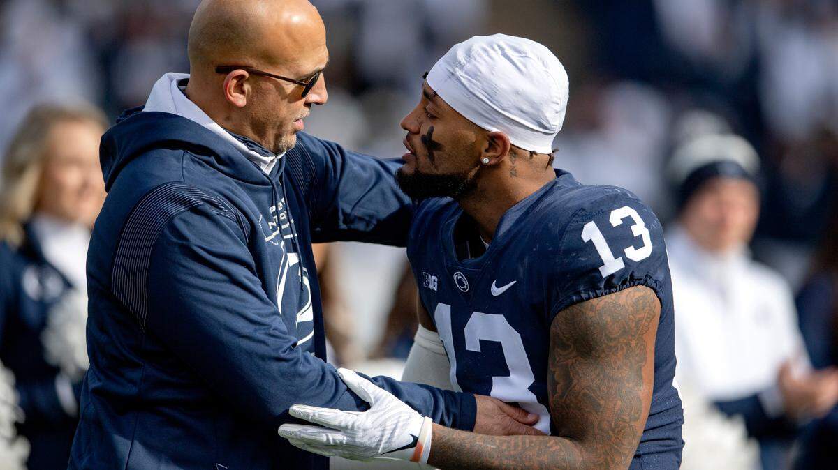 Penn State linebacker Ellis Brooks is congratulated by coach James Franklin during the senior day celebration before the game against Rutgers on Saturday, Nov. 20, 2021.