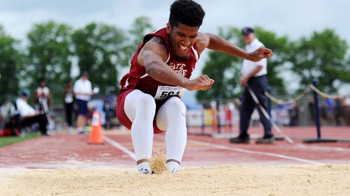 State College's Brandon Clark, seen competing in the 2017 PIAAA boys triple jump, was a medalist indoors and outdoors last year.