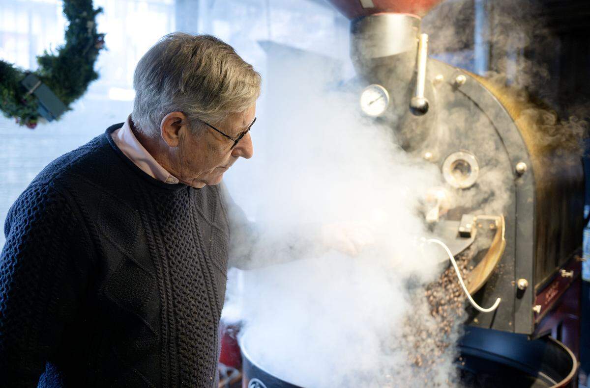 Steam fills the air as Bill Clarke roasts coffee beans at The Cheese Shoppe on Wednesday, March 4, 2026. 
