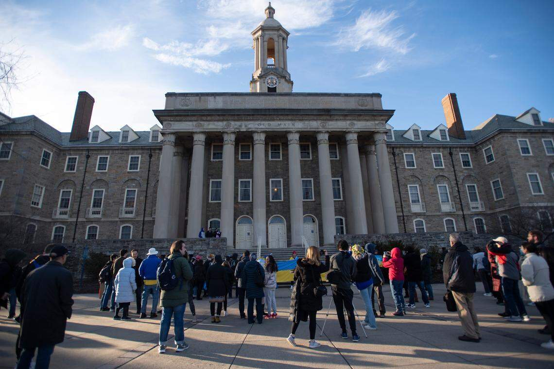 Protesters gathered at an event hosted by the Ukrainian Society at Penn State in front of Old Main on Thursday.