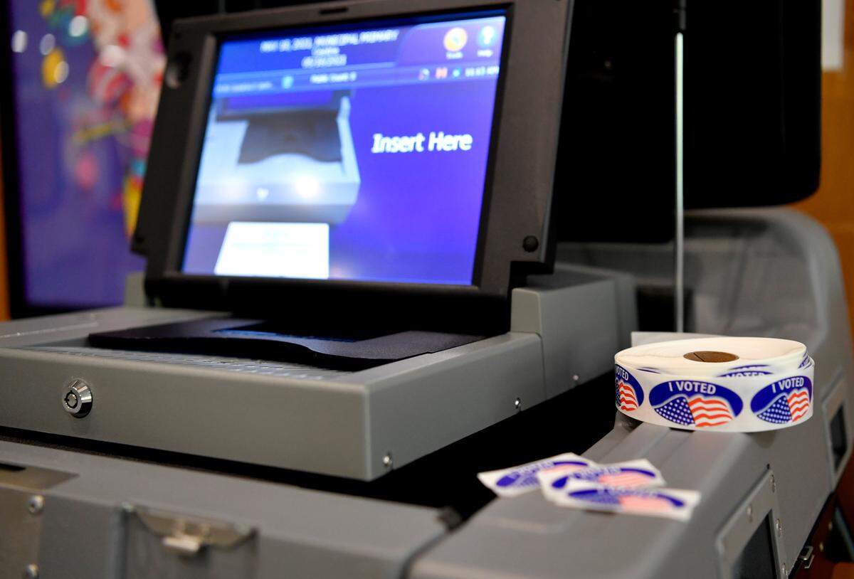 Voting stickers sit on the ballot machine at the State College Municipal Building Tuesday for the primary election.